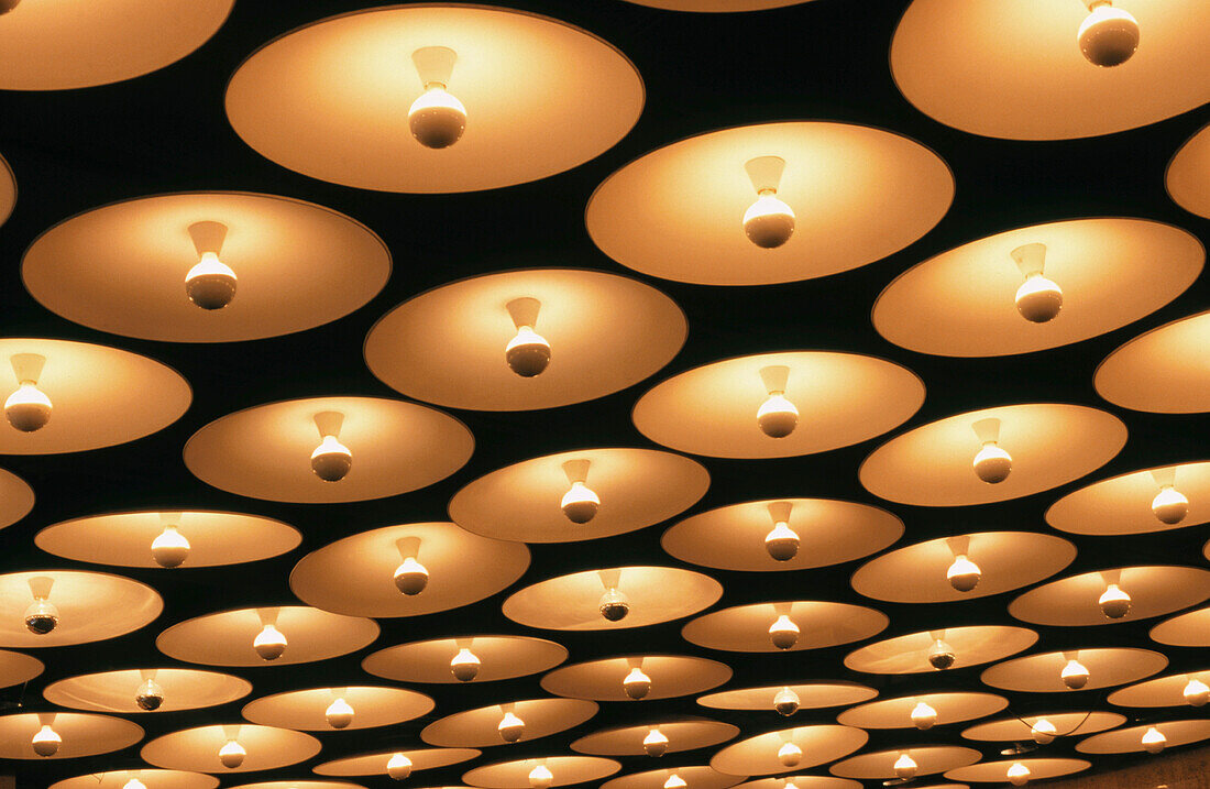 Abstract view of ceiling light fixtures in the lobby of a building