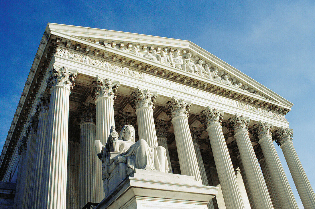 The Supreme Court building and statue. Washington DC. USA.