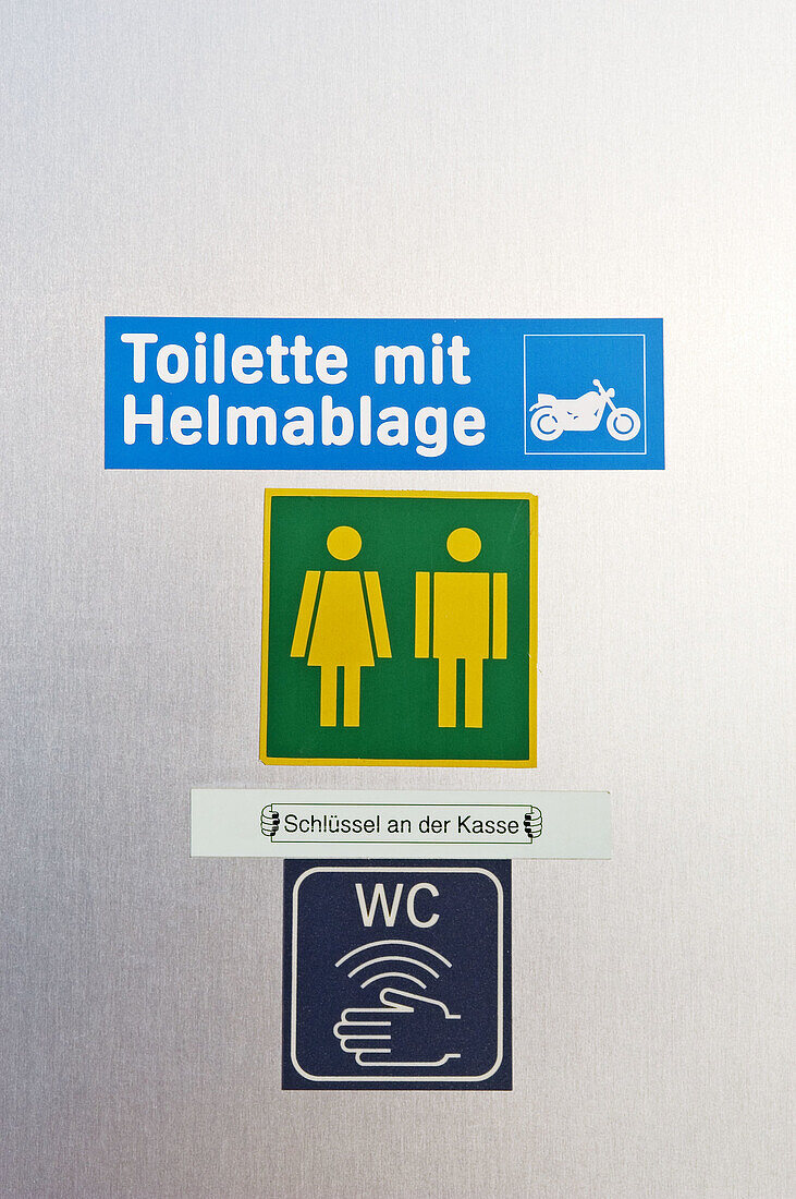 Toilet sign at gas filling station. Germany