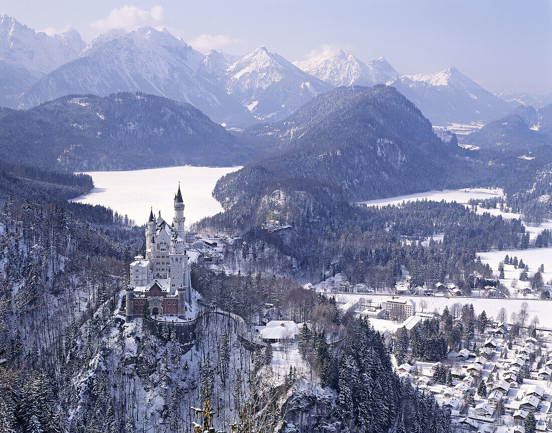 The castle Neuschwanstein in front of the snow covered Alpsee near Füssen. Germany.