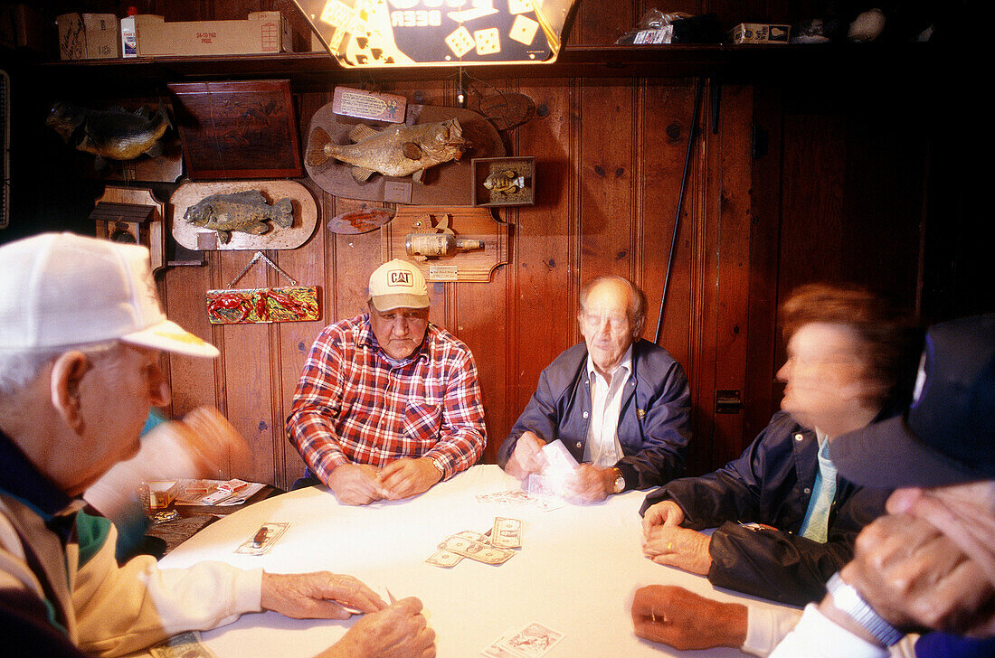Cajuns playing a game cards called la bourre . Houma City. Louisiana. USA