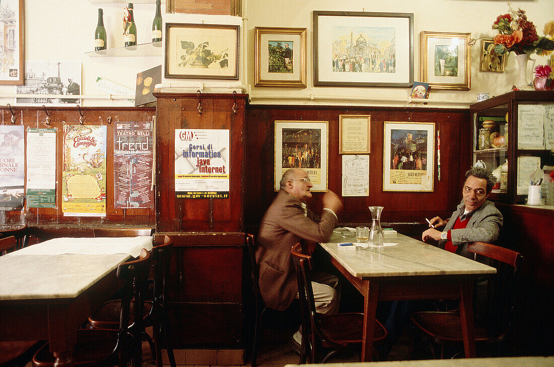 Men having a chat. Restaurant Adda s. Rome. Italy.