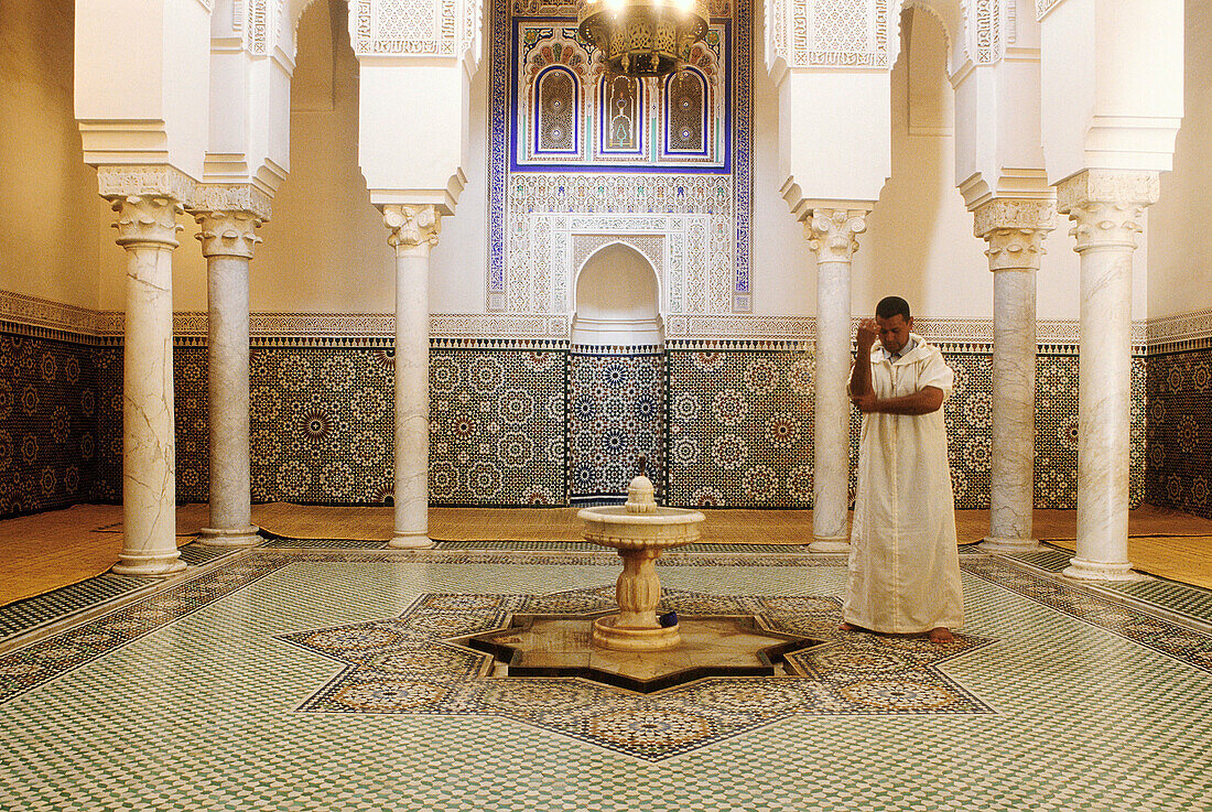 Muslim washing before prayer. Moulay Ismail Memorial. Meknès. North Morocco.
