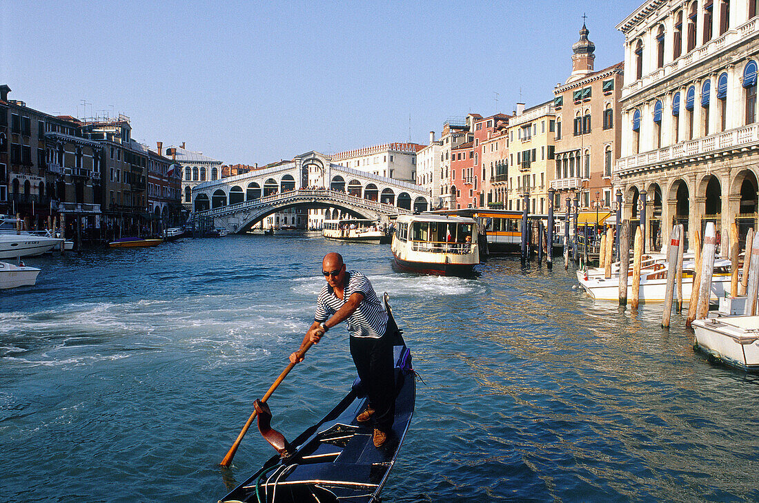 Rialto Bridge. Gondola. Venice. Veneto. Italy.