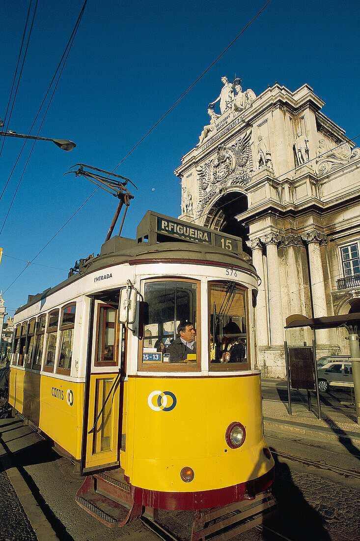 Tram and Rua Augusta Arch in background. Praça do Comércio. Lisbon. Portugal