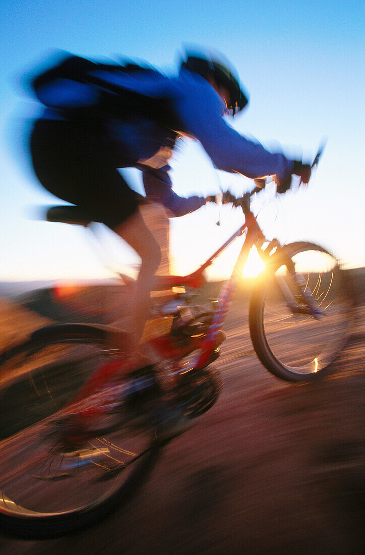 ability, activity, adult, bicycle, bicyclist, biker, blurred motion, Color image, contemporary, cycle, cycling, day, energy, exercise, fit, health, healthy, human, leisure, Male, Man, Man only, motion, mountain biking, moving, one, one person, outdoor, pe