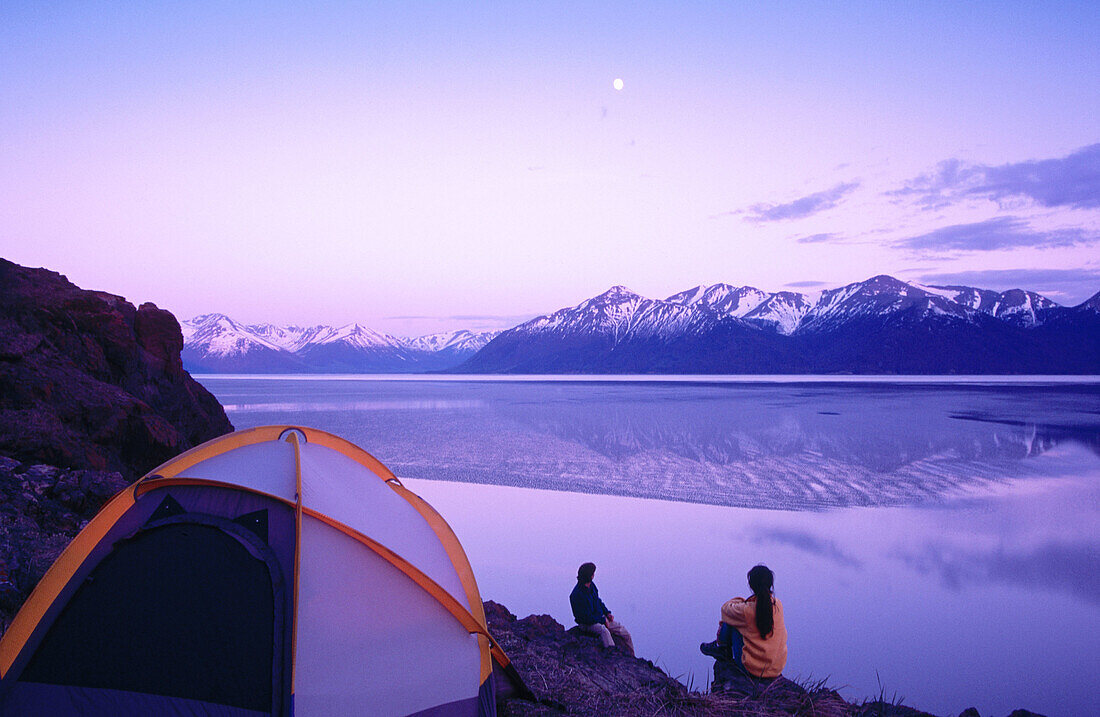 Couple at camp above Turnagain Arm. Chugach State Park. Alaska