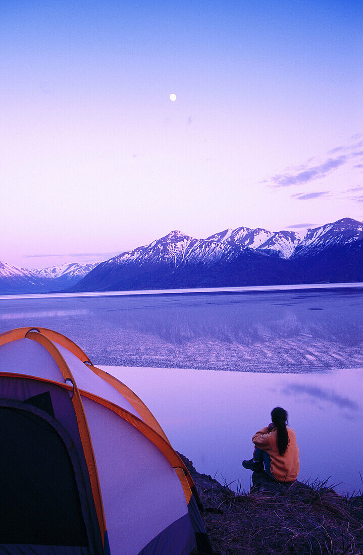 Watching moonrise over Cook Inlet. Chugach State Park. Alaska