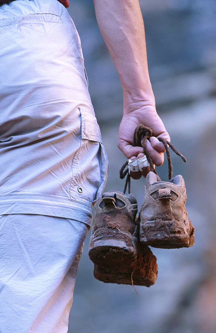 Hiker with muddy boots. Utah, USA