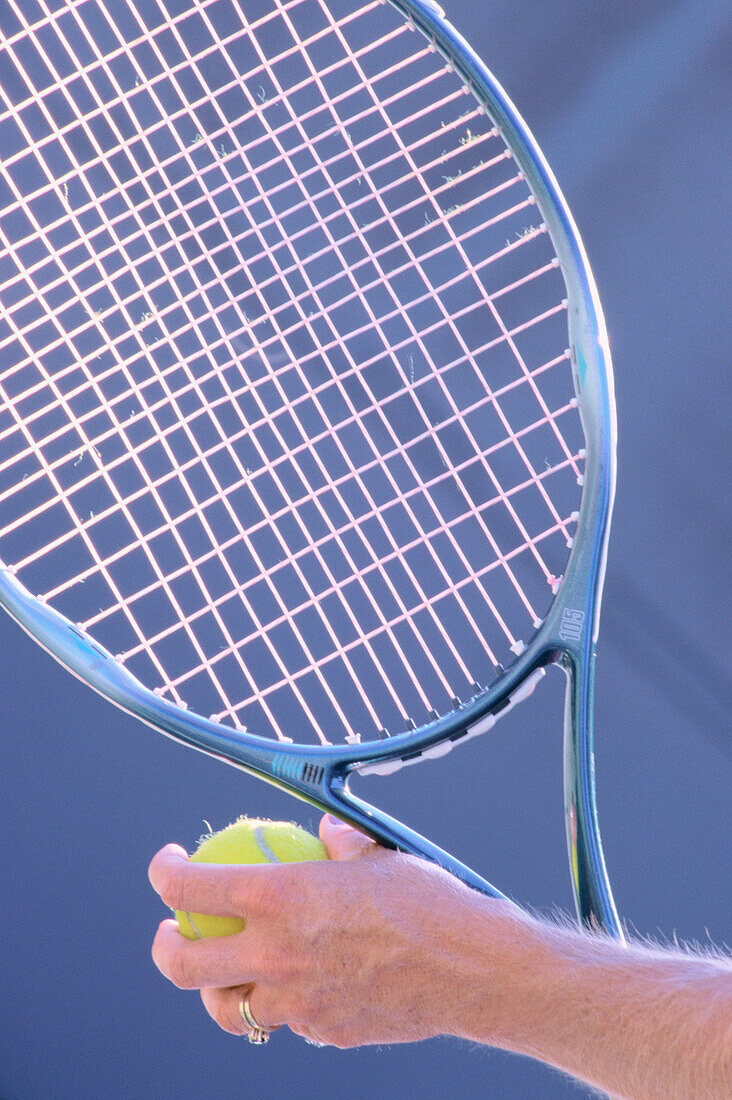 Woman holding tennis racquet