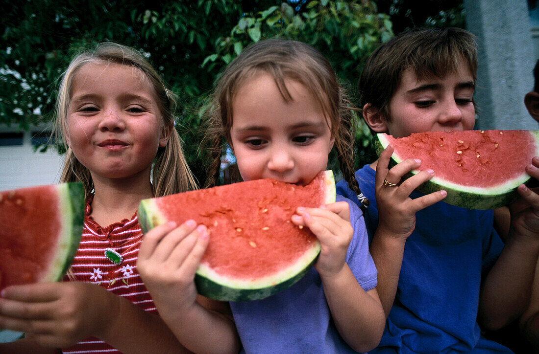 Friends eating watermelon