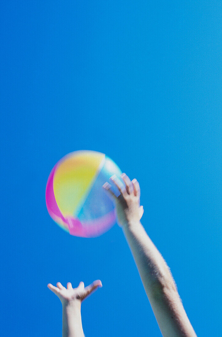 Child catching a beach ball