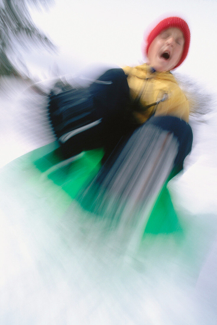 Boy sledding