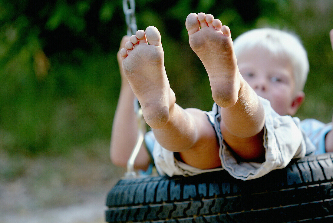 ldhood, Children, Close up, Close-up, Closeup, Color, Colour, Contemporary, Daytime, Dirty, Exterior, Horizontal, Human, Infantile, Kid, Kids, Leisure, Male, Motion, Movement, Moving, One, One person