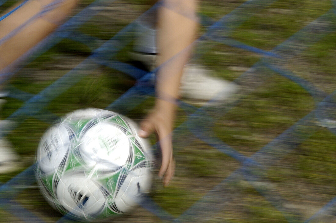  Ability, Action, Activity, Anonymous, Ball, Balls, Blurred, Color, Colour, Contemporary, Country, Countryside, Daytime, Detail, Details, Exterior, Football, Horizontal, Human, Leg, Legs, Leisure, Motion, Movement, Moving, One, One person, Outdoor, Outdoo