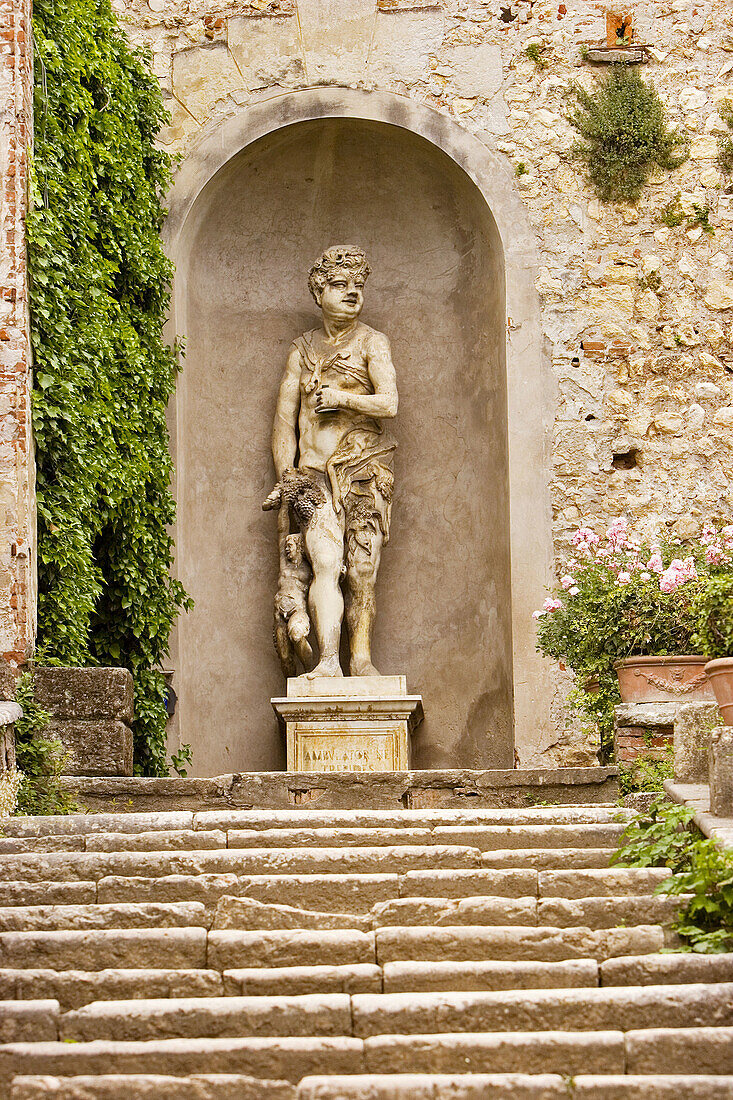 Renaissance marble statue of mythological being standing in niche, in the Giardino Giusti, Verona, Italy