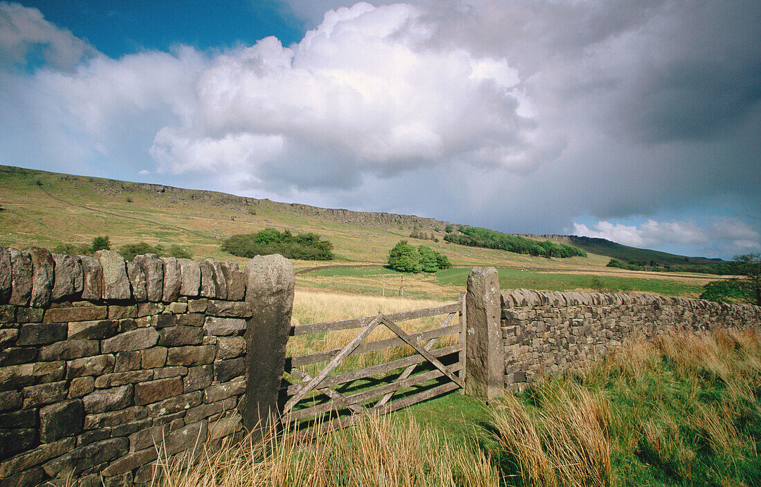 Wooden gate & dry stone wall. Stanage Edge. Peak District National Park. UK