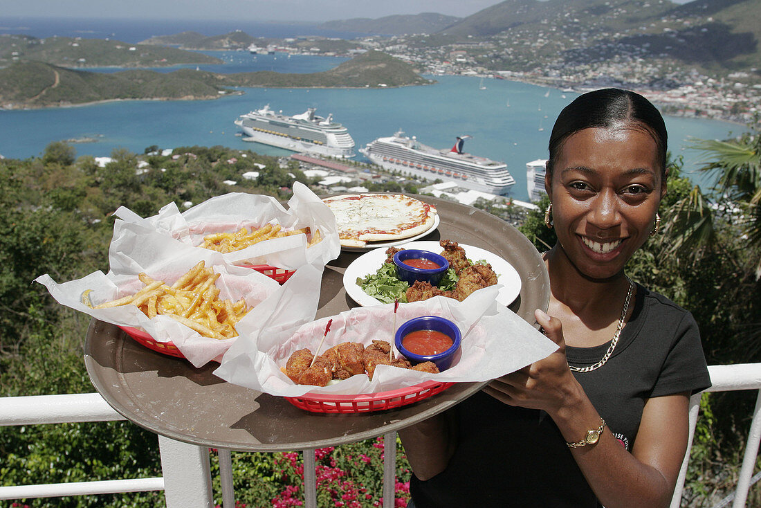 Black female waitress, food, Charlotte Amalie Harbor, Caribbean Sea, cruise ships. Paradise Point. St. Thomas. US Virgin Islands.