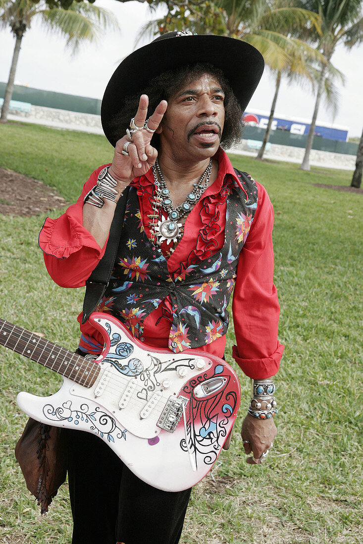 Florida, Miami Beach, Ocean Drive, Motorola Mile, Super Bowl XLI. Black male, Jimi Hendrix look alike, street performer
