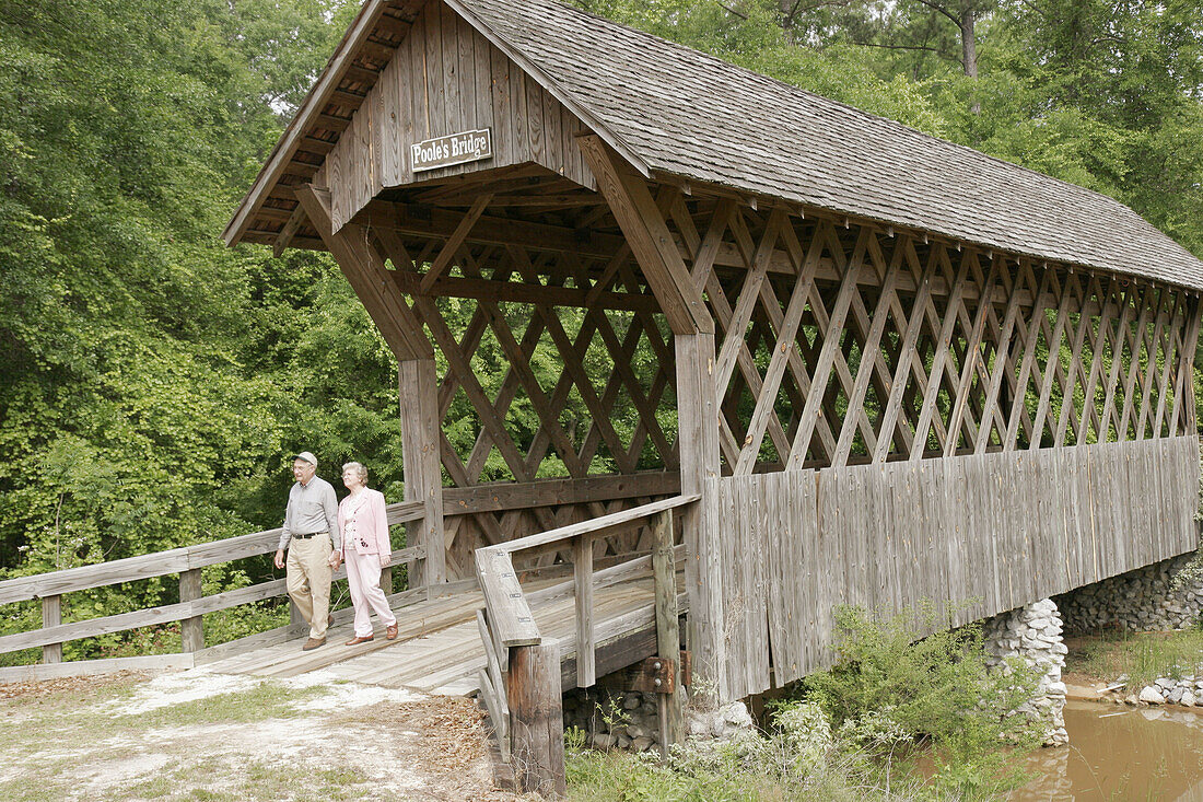 Pioneer Museum of Alabama, restored Poole s Bridge, covered, senior couple. Troy. Alabama. USA.