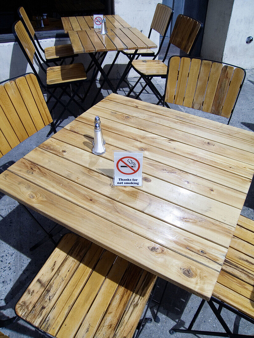 No smoking sign on table in outdoor café