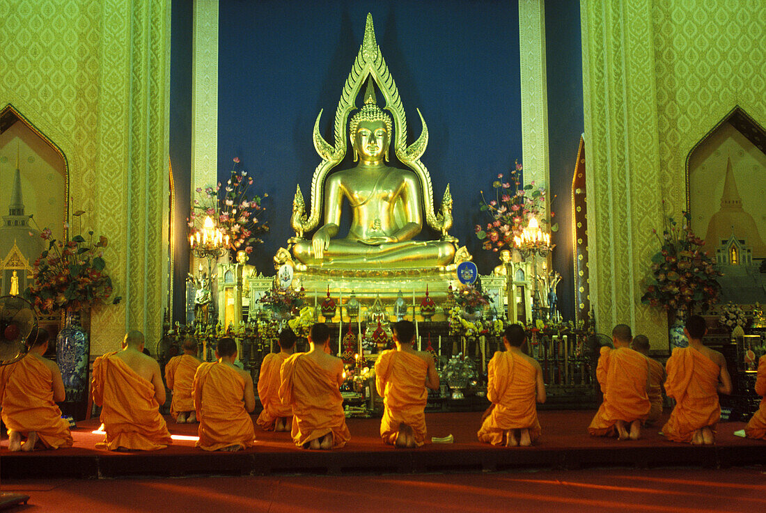 Buddist monks praying, Wat benchamabophit (marble temple)bangkok, Thailand.