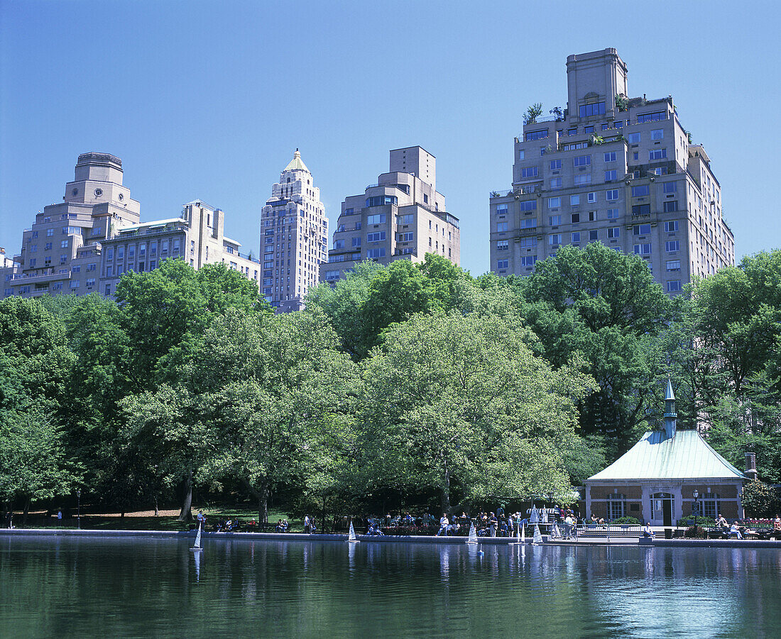 Boat pond, Central park east skyline, Manhattan, New York, USA.