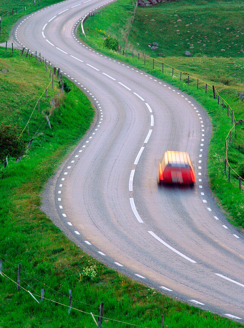 Car braking ion a curvy road. Brosarp. Skane. Sweden