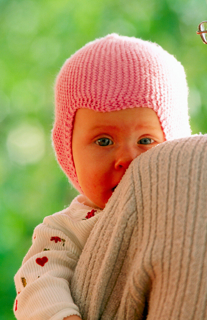  1 to 6 months, 1-6 months, Adult, Adults, Affection, Babies, Baby, Blue eyed, Blue eyes, Blue-eyed, Bonding, Caucasian, Child, Children, Close up, Close-up, Color, Colour, Contemporary, Exterior, Face, Faces, Families, Family, Female, Fondness, Hat, Hats