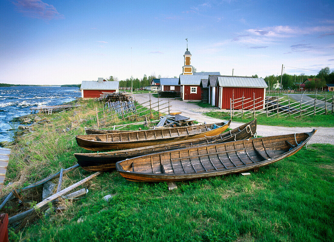 Wooden boats at Torne river by the Finnish border in the small fishing village of Kukkola, Norrbotten, Sweden