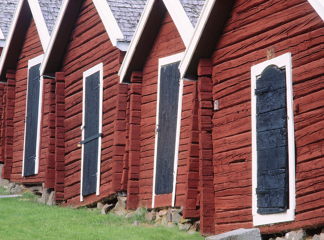 Black doors on some old stables situated by church in Nordingrå. Ångermanland, Sweden