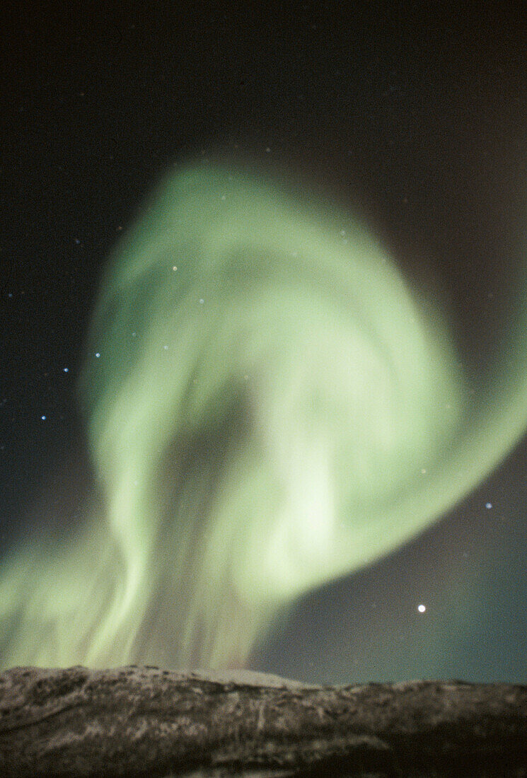 Northern lights (Aurora borealis). Over the mountains. Bardu. Norway.