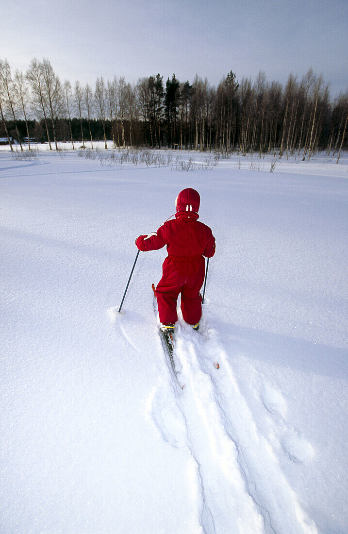 A three years old girl skiing at winter. Medle. Västerbotten, Sweden