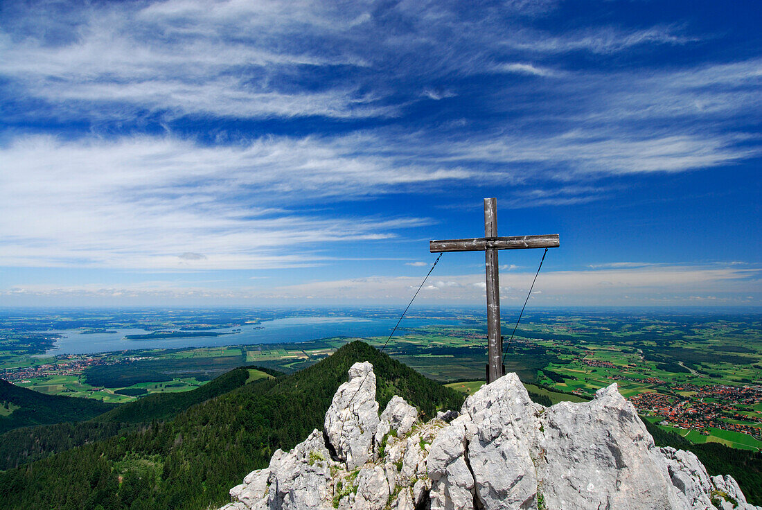 cross on summit of Friedenrath and view to lake Chiemsee and the valley of Grassau, Chiemgau, Upper Bavaria, Bavaria, Germany