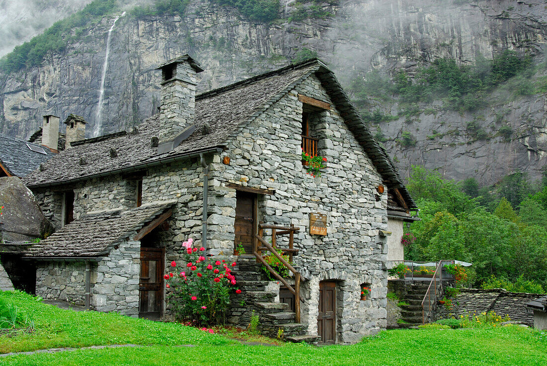 stone house with flower decoration, Sonlerto, Ticino, Switzerland