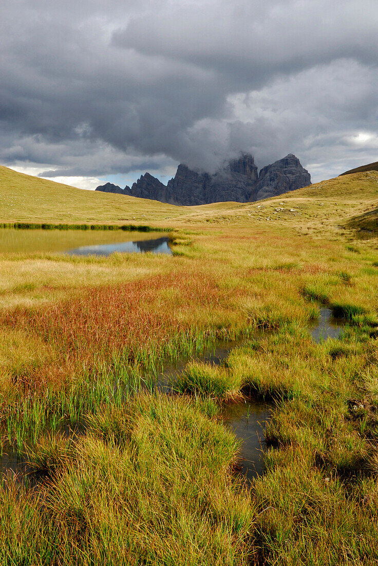 Lake Lago Delle Baste with Pelmo in clouds, Alta Via delle Dolomiti number one, Dolomites, Cortina d'Ampezzo, Venezia, Italy