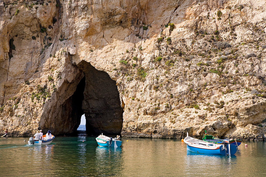 Boats on Dwejra Lake in front of a cave, Gozo, Malta, Europe