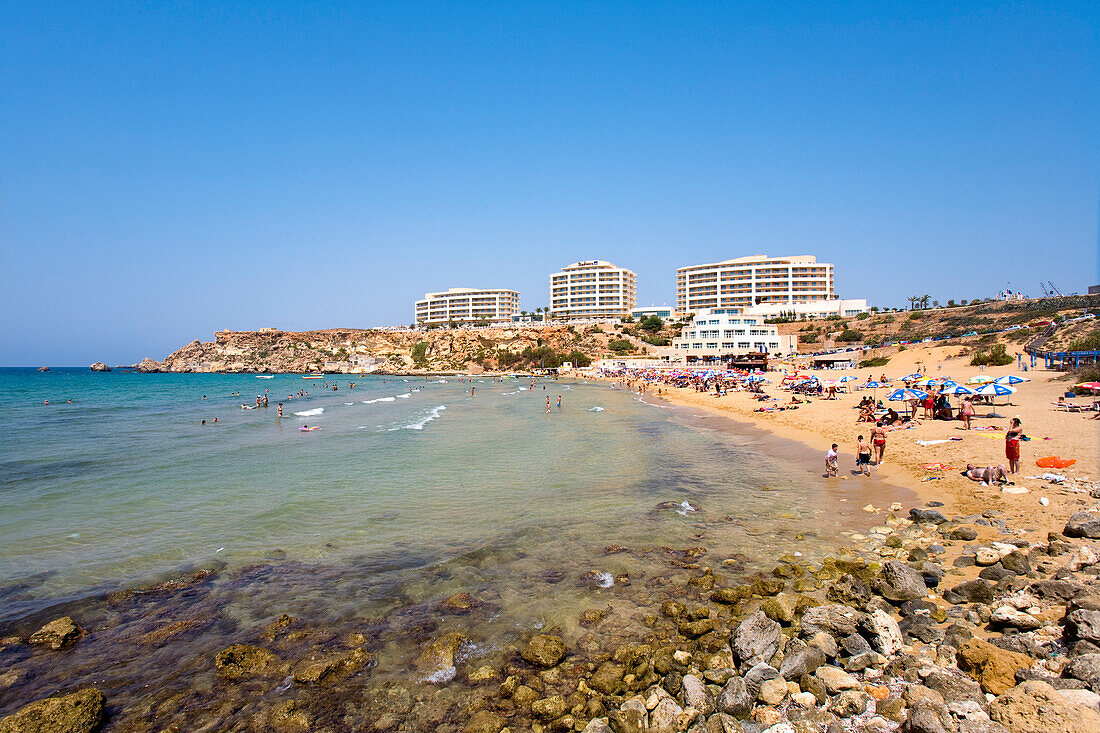 People at the beach in the sunlight, Golden Bay, Malta, Europe