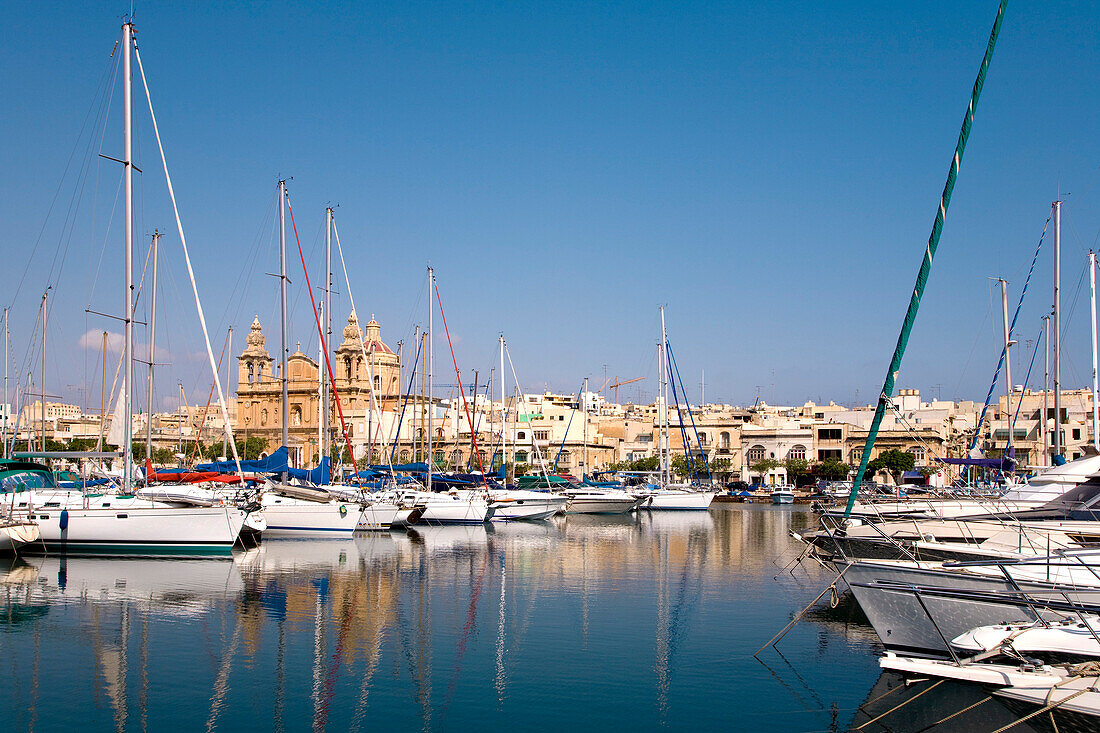 Sailing boats at the marina in front of St. Joseph Church, Msida, Malta, Europe