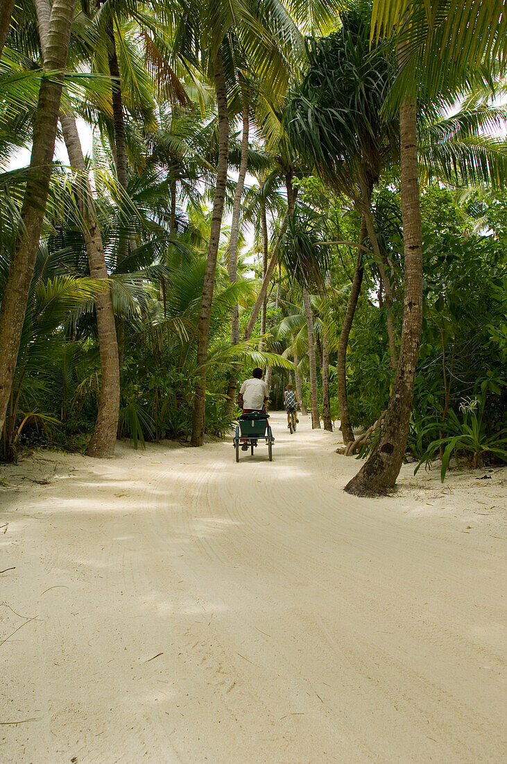 Two cyclists at the One & Only Resort Reethi Rah, Maldives