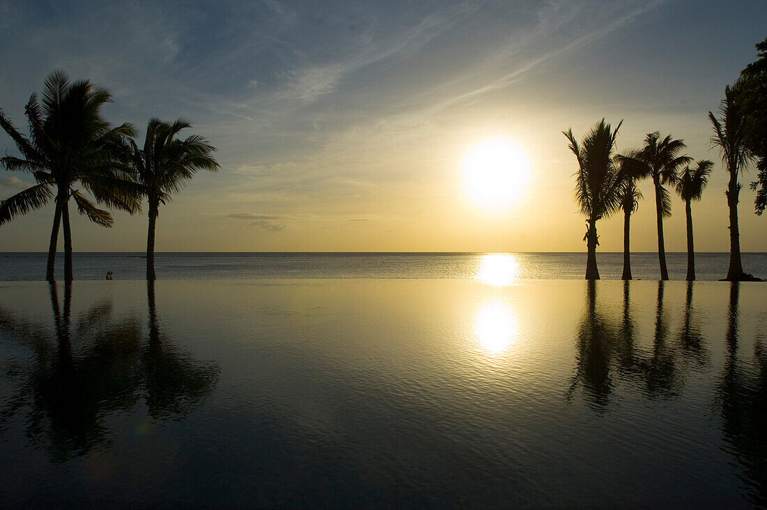 Sunset over the main pool, Hotel Taj Exotica Resort & Spa, Mauritius