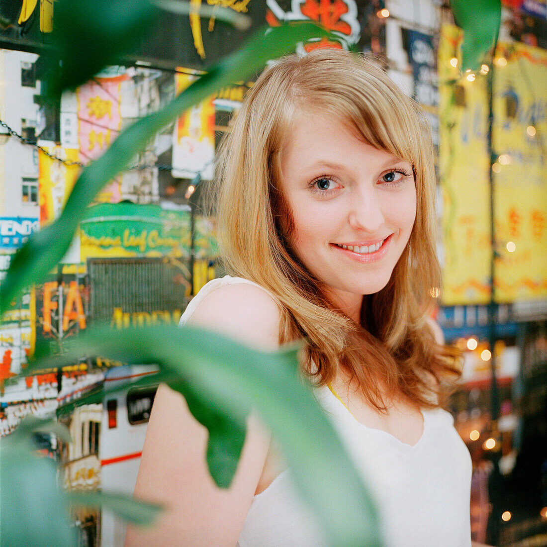 Young woman smiling at camera, portrait, Düsseldorf, North Rhine-Westphalia, Germany