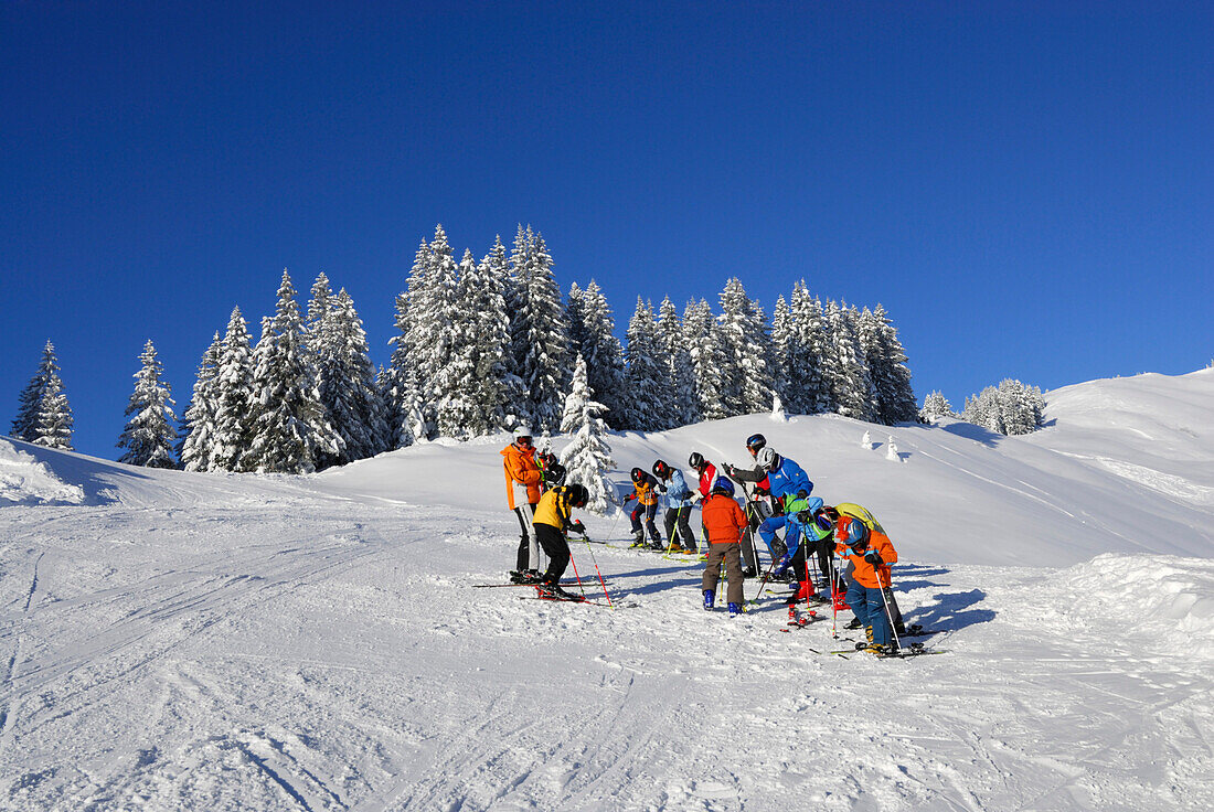 snow-covered mountain scenery with ski track and skiers, Riedberger Horn, Grasgehrenlifte, Allgaeu range, Allgaeu, Swabia, Bavaria, Germany