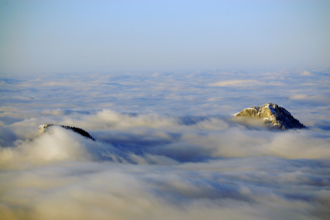 Mountain Kranzhorn and Heuberg over fog bank in the Inn valley, Zahmer Kaiser, Kaiser range, Tyrol, Austria