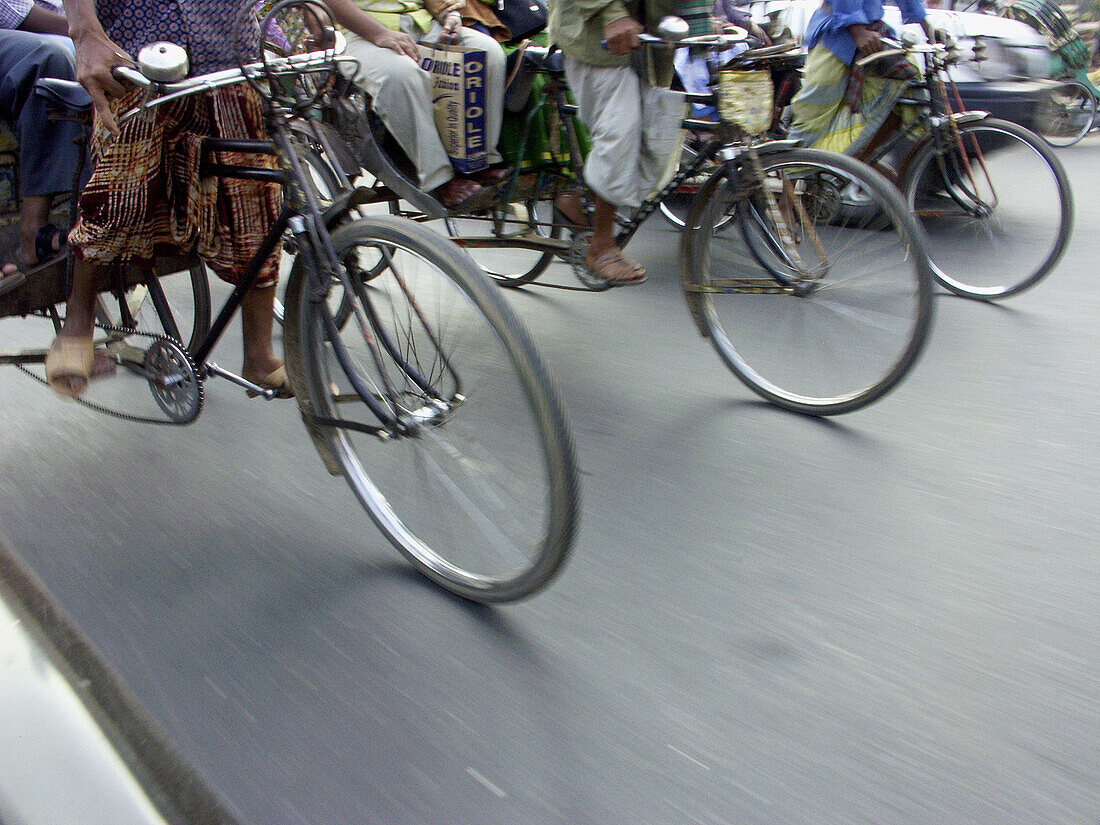 Bicycle rickshaw drivers at work. Dhaka, Bangladesh