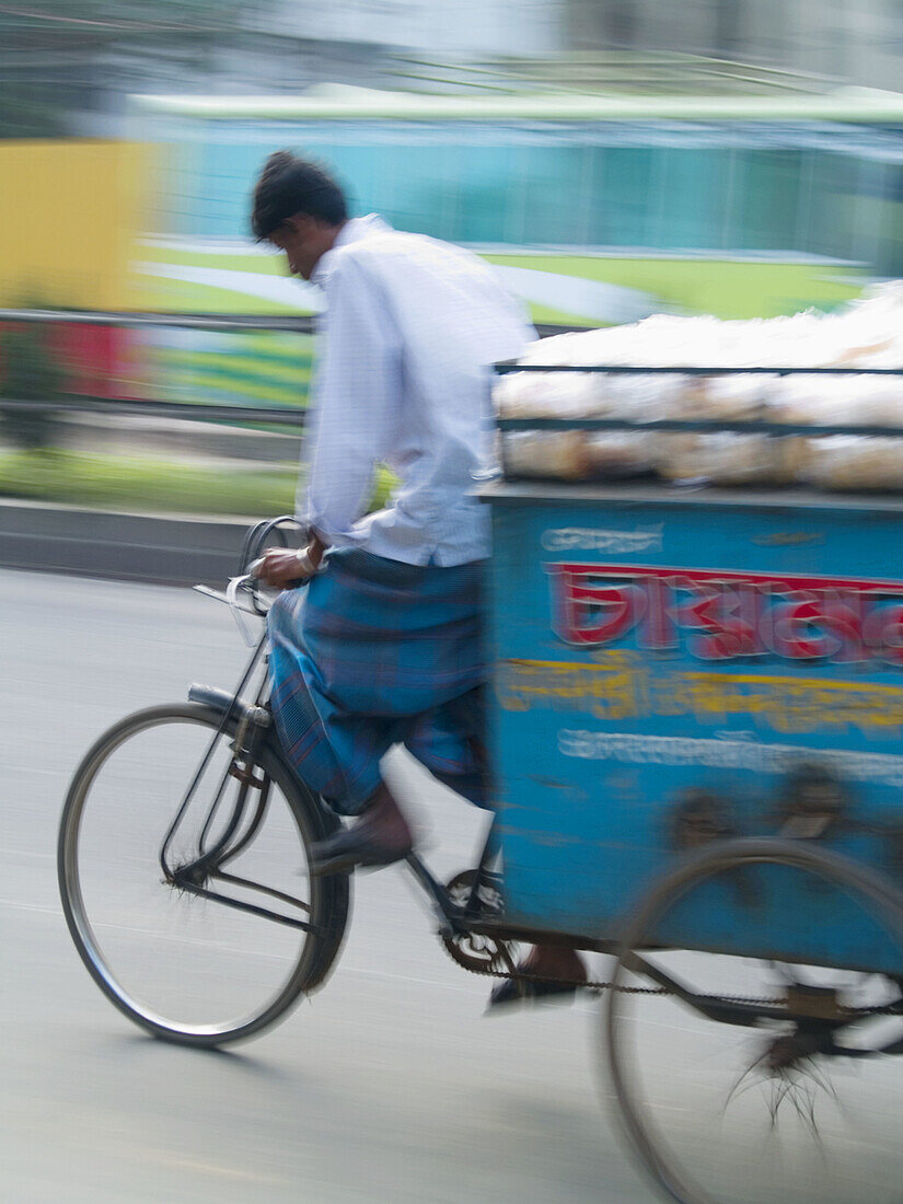 Feet of bicycle rickshaw driver at work in Dhaka, Bangladesh