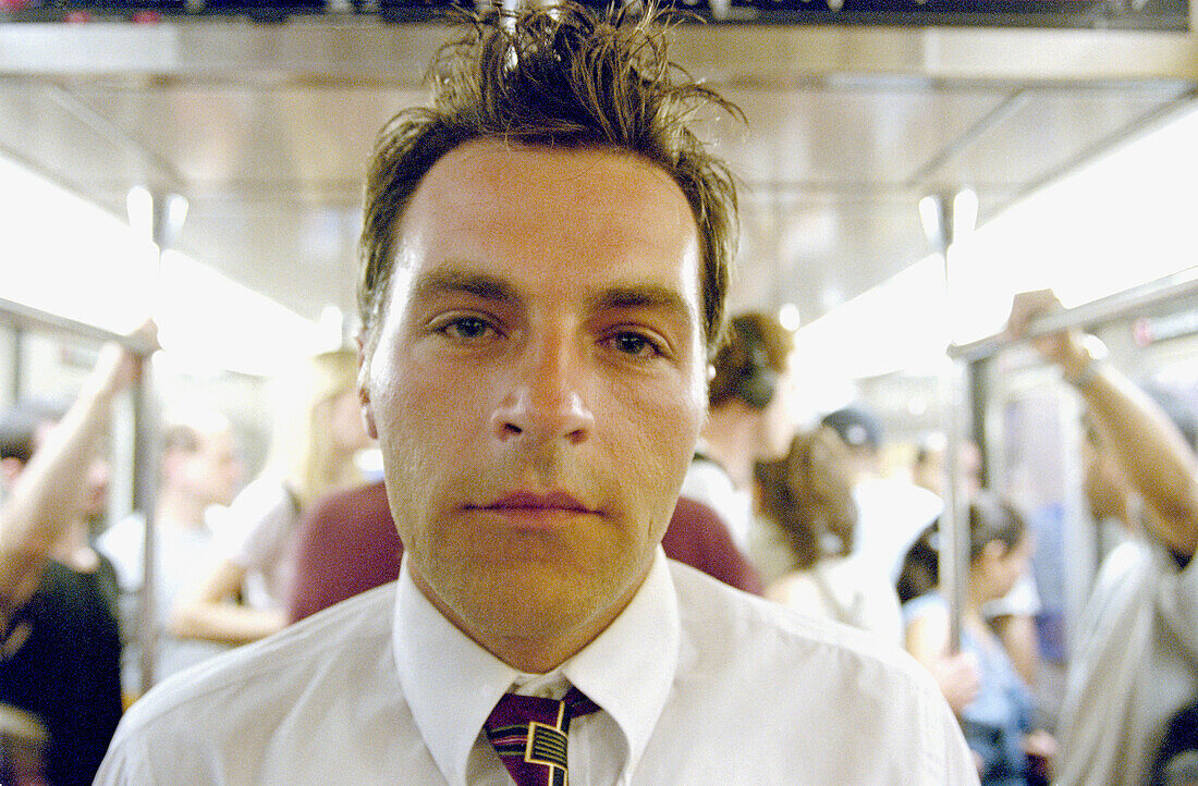 Businessman on subway train. New York city. USA.