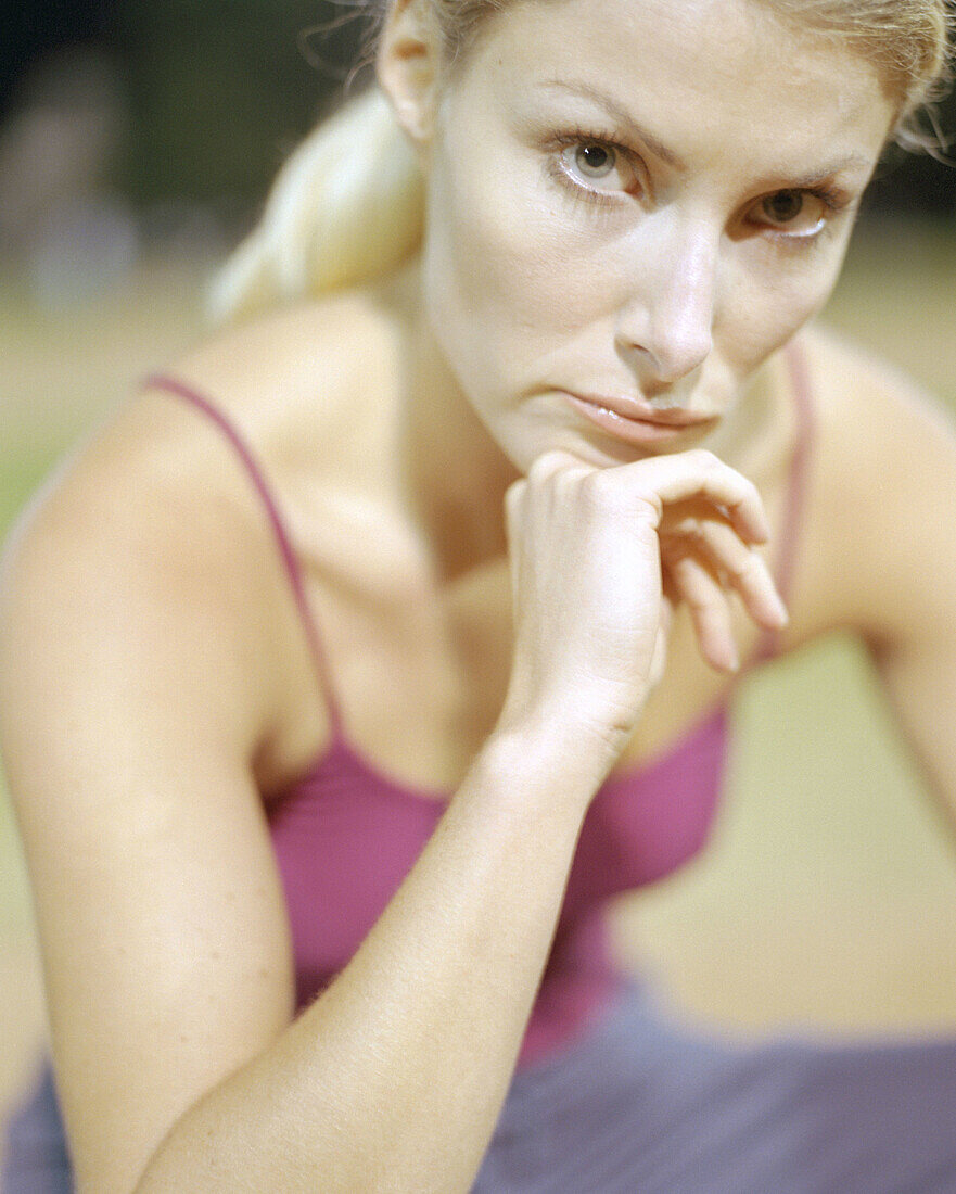 Woman in her mid 20 s doing yoga in the park. Santa Monica. California. USA.