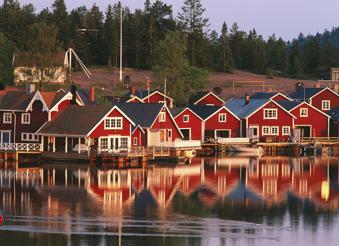 Boathouses in evening light. Norrfällsviken. Ångermanland. Sweden
