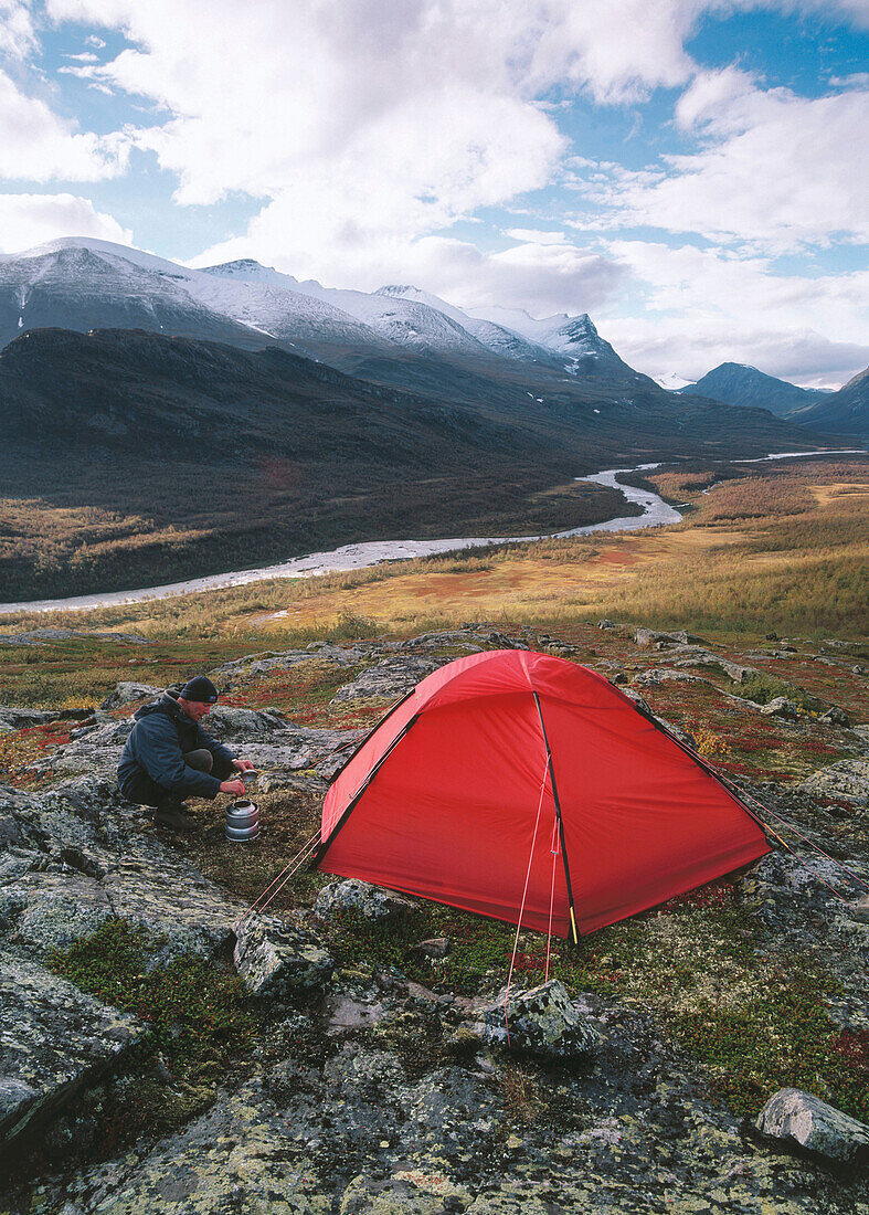 Man and tent. Sarek National Park. Lapland. Sweden
